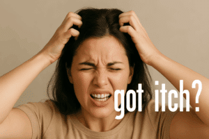 Woman scratching her itchy scalp with a frustrated expression, text overlay reads “got itch?”—visual concept for blog post about oily scalp and scalp inflammation.